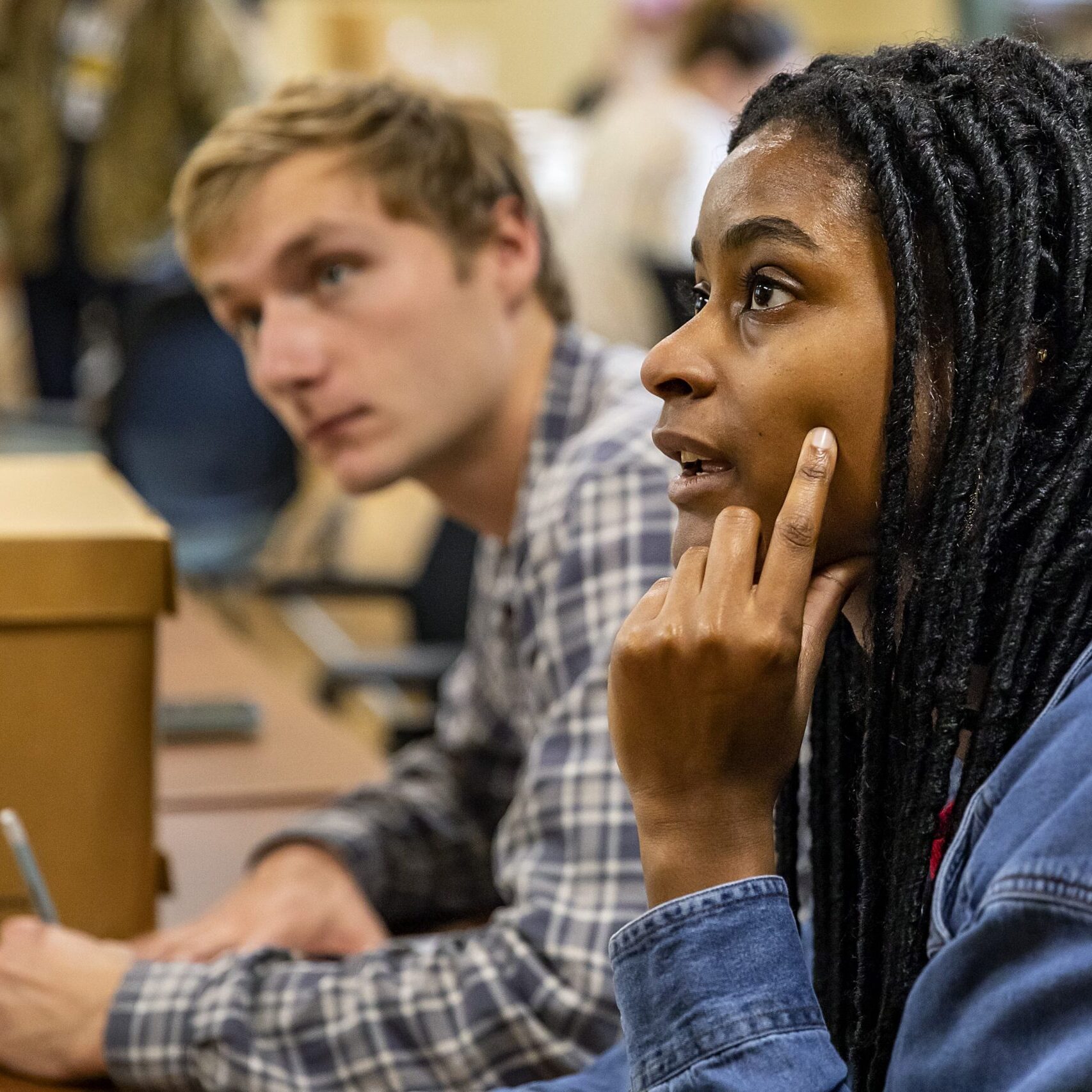 Students in Katherine Turk's class titled "Women in the History of UNC-Chapel Hill" learn about resources available to them at Wilson Library 