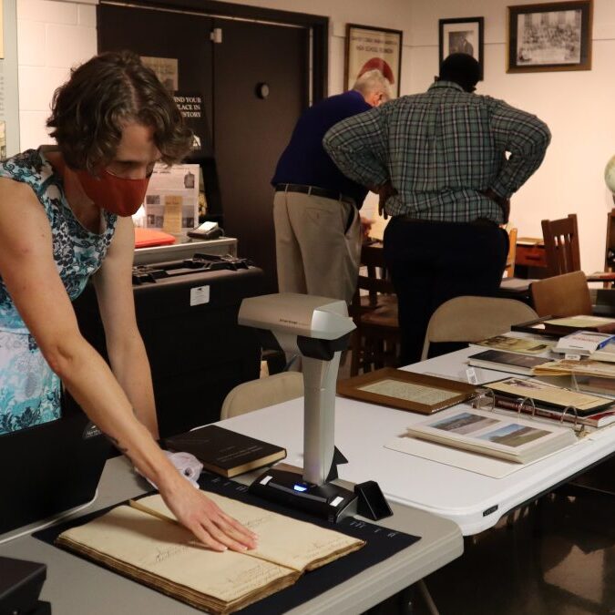 Members of the North Carolina Digital Heritage Center scan documents in Camden County. (Photo by the University Libraries)
